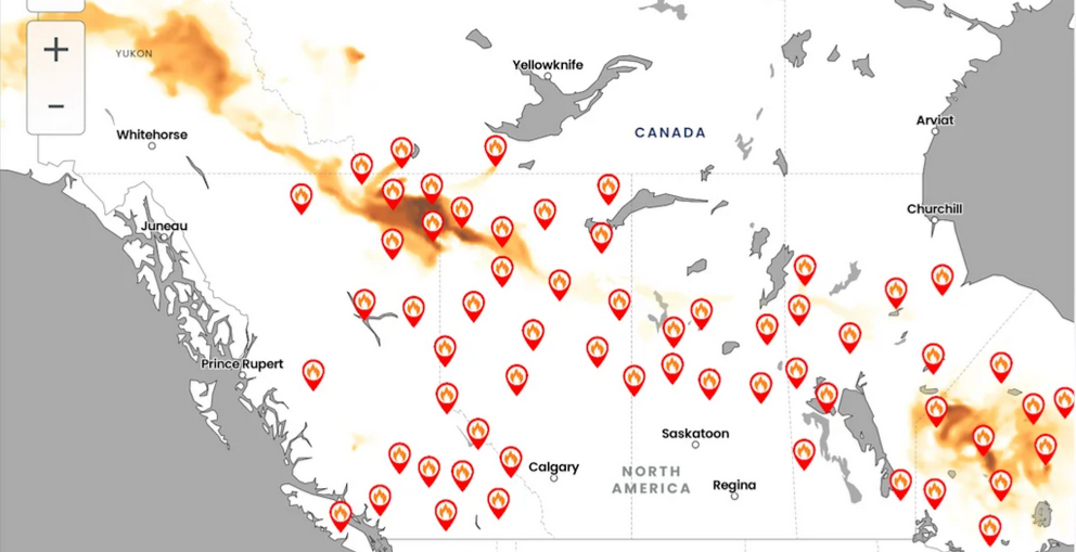 Fire and Smoke map showing wildfires across Canada with concentrations of smoke blowing both west and north of the fire spots