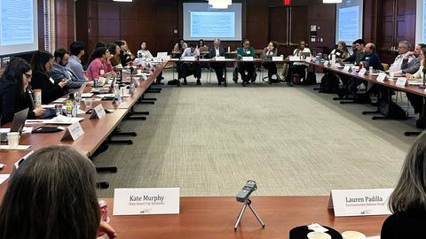 The Air Quality Cohort group at conference around a table