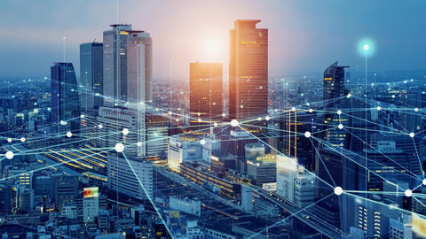 City skyline overlaid with futuristic nodes and network lines
