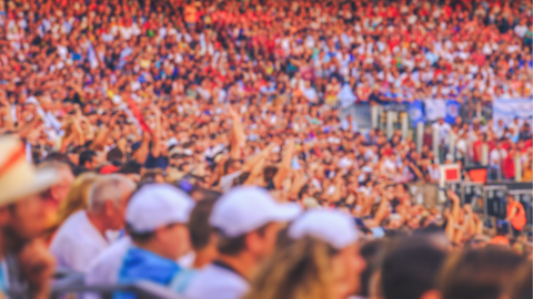 Crowd in stadium on a hot day