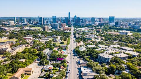Austin skyline in distance with houses in the foreground