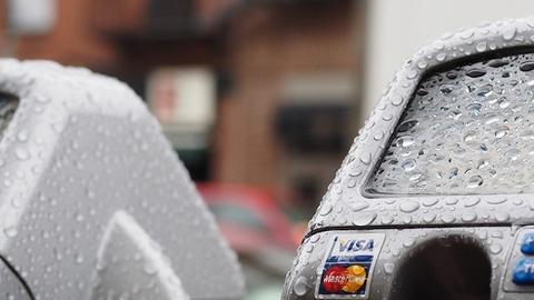 Parking meters in the rain