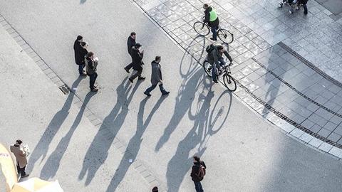 Pedestrians and bikers crossing a street