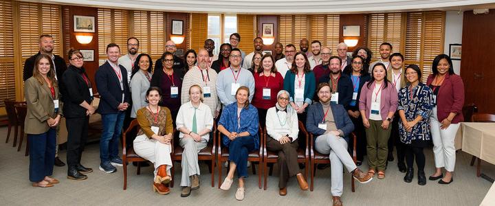Large diverse group of attendees posing for a formal photo