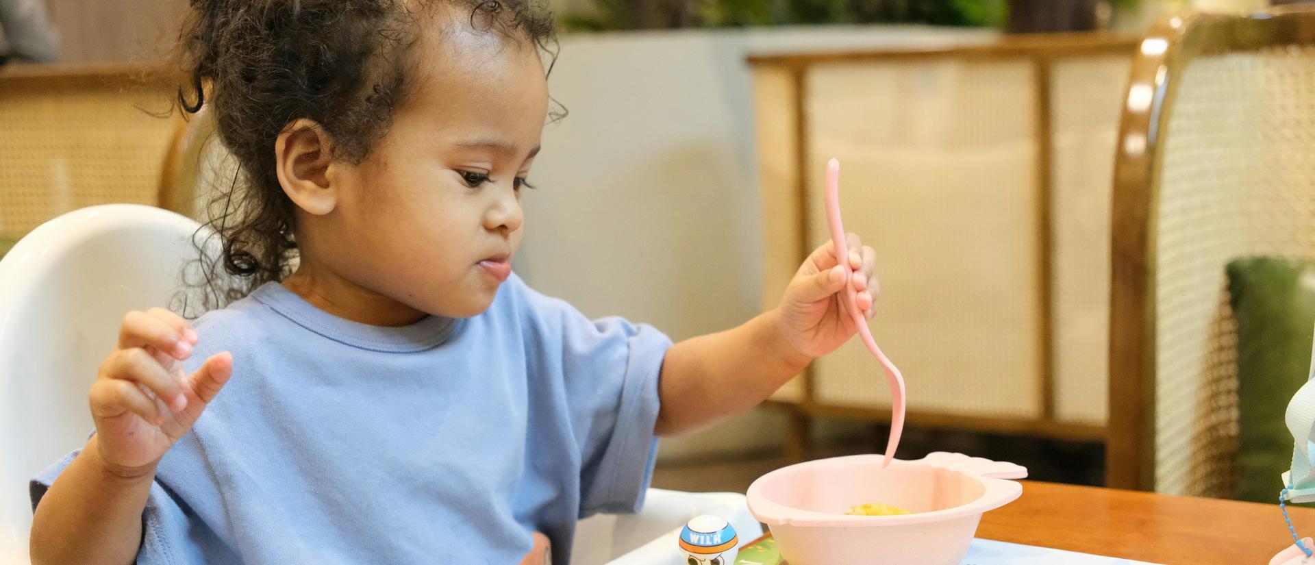 Child eating in high chair
