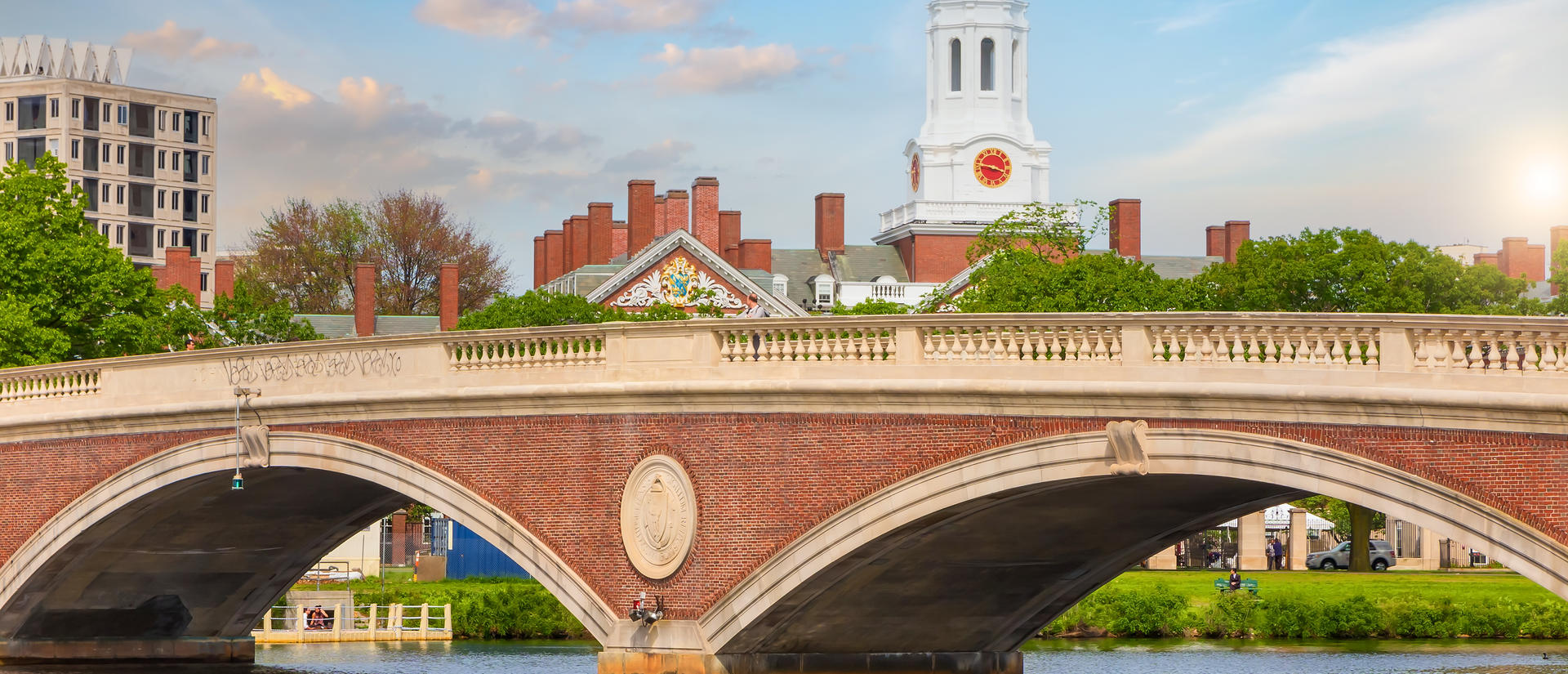Harvard University campus and bridge over the Charles River. Image from Adobe Stock.