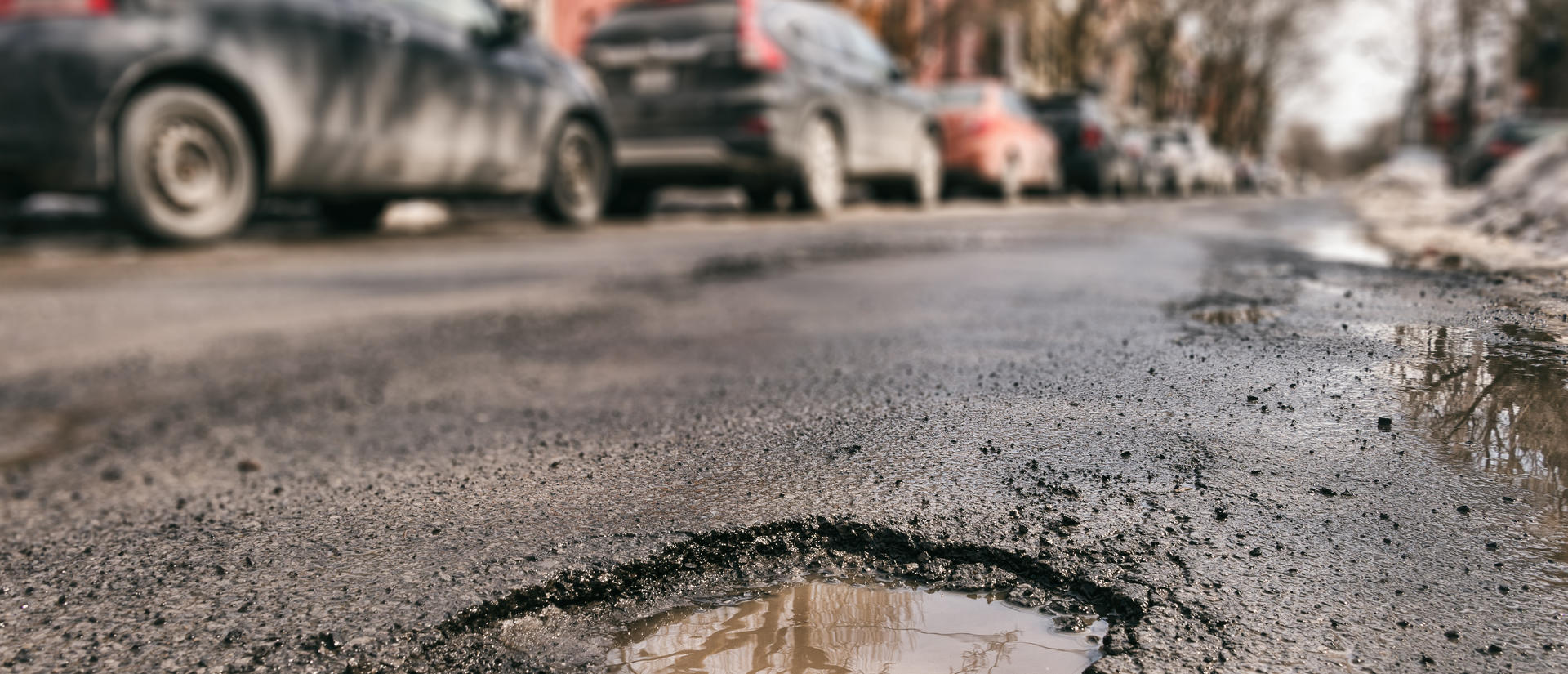 Pothole in street. Image from Adobe Stock.