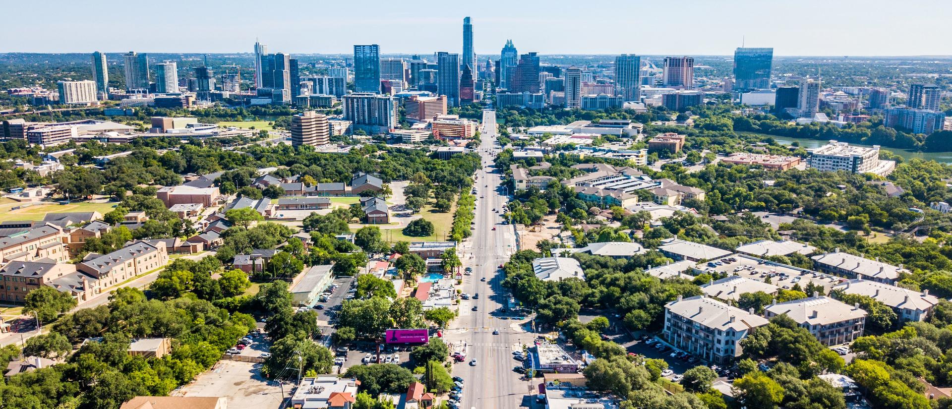 Austin skyline in distance with houses in the foreground