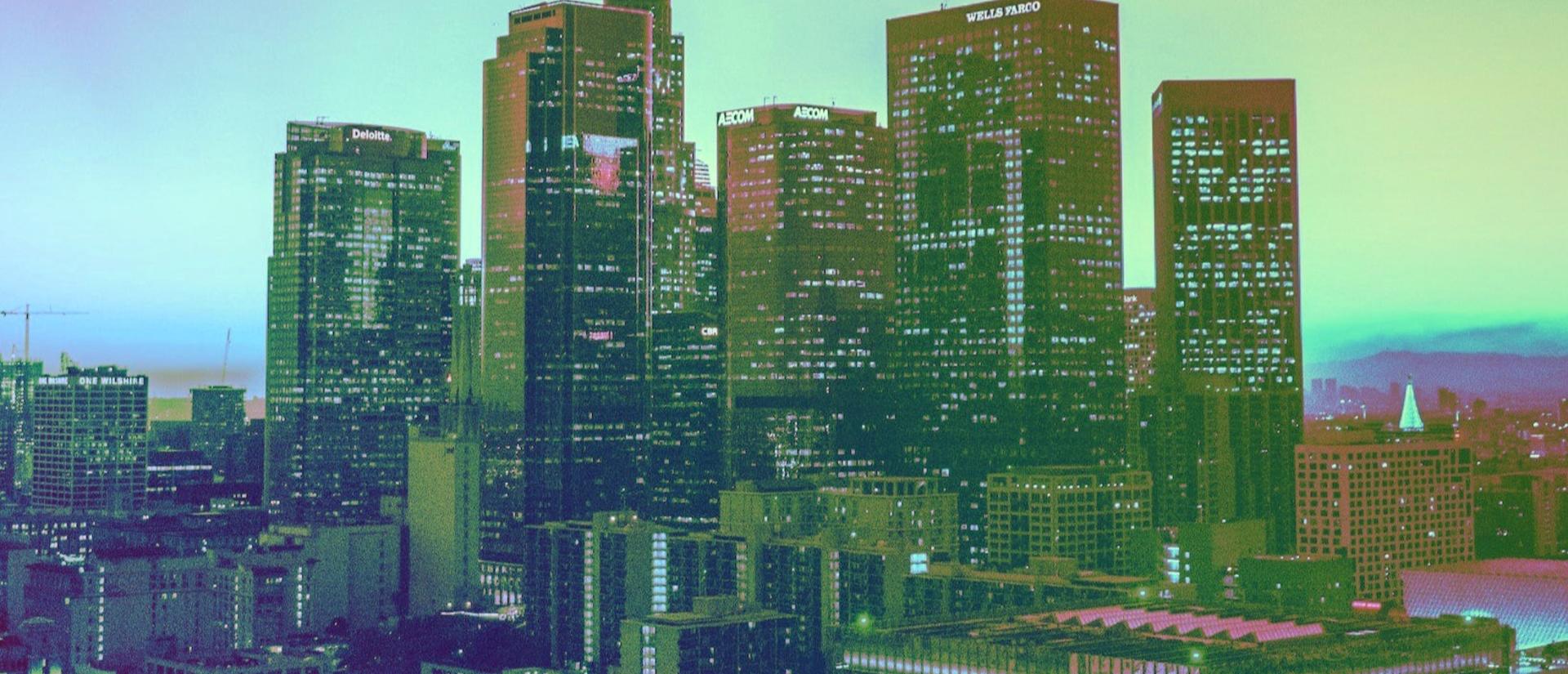 Stylized city skyline with multicolored sky