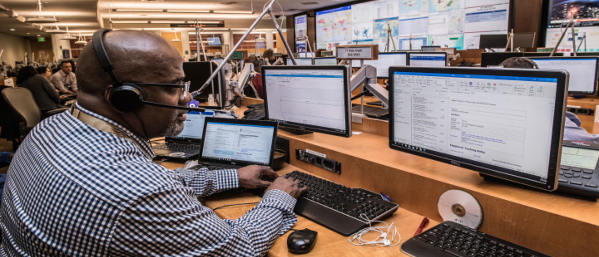 Black man working at an emergency call center