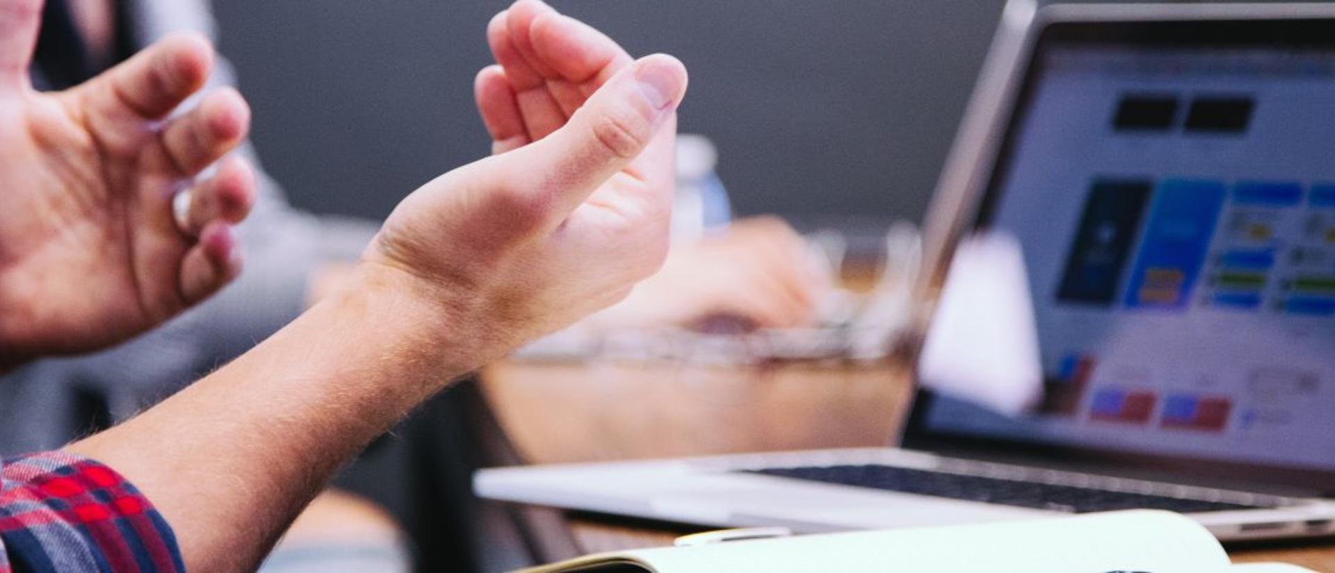 Close up on hands and laptop