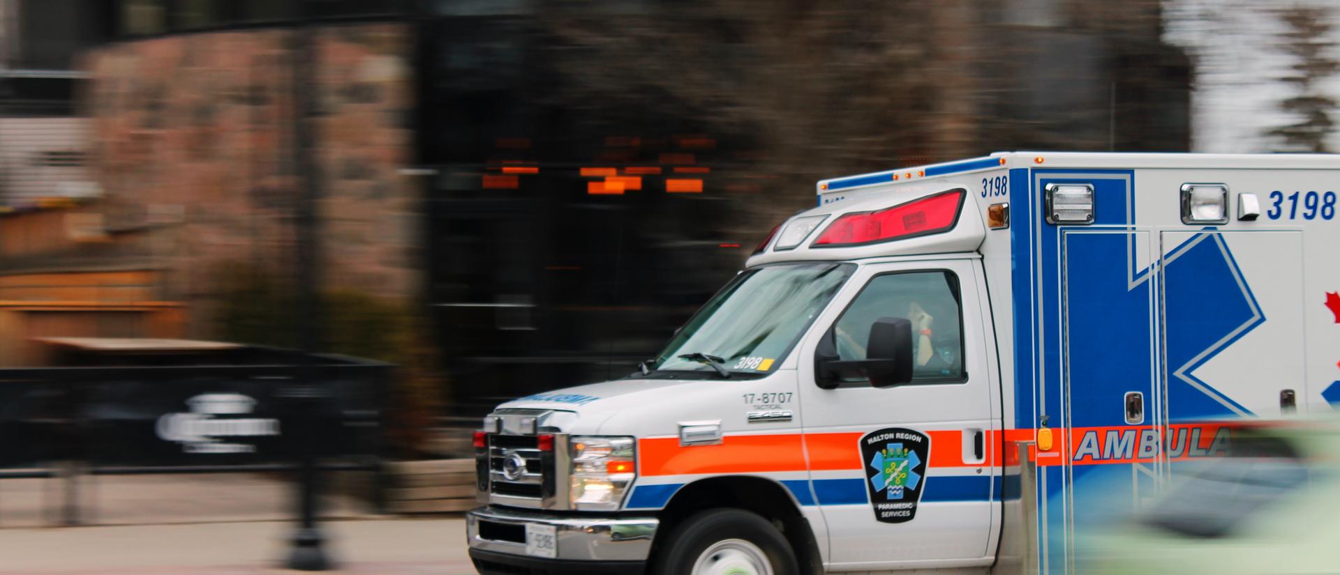 Ambulance speeding down city street