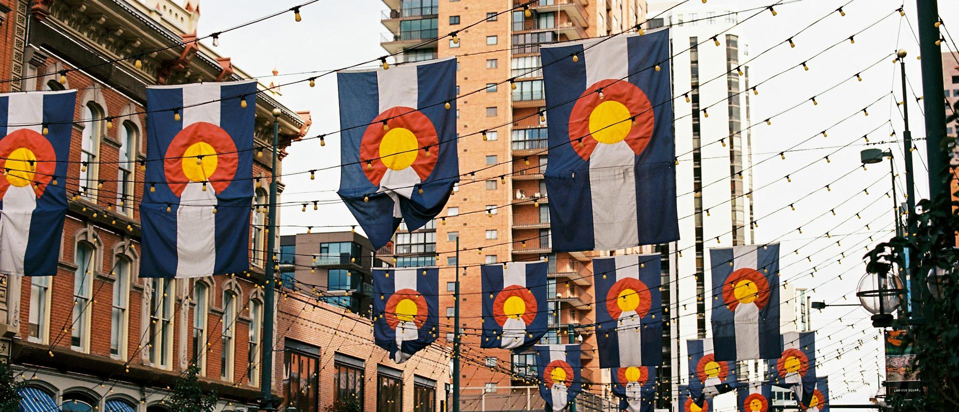 Downtown Denver with flags hanging across the streets