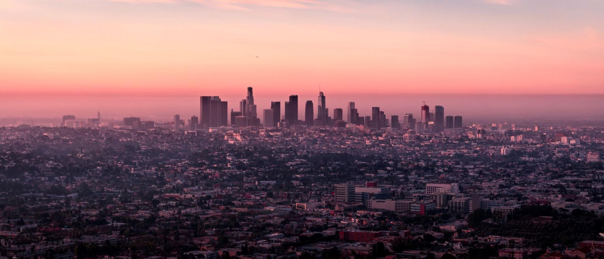 City skyline at sunset, seen from distance
