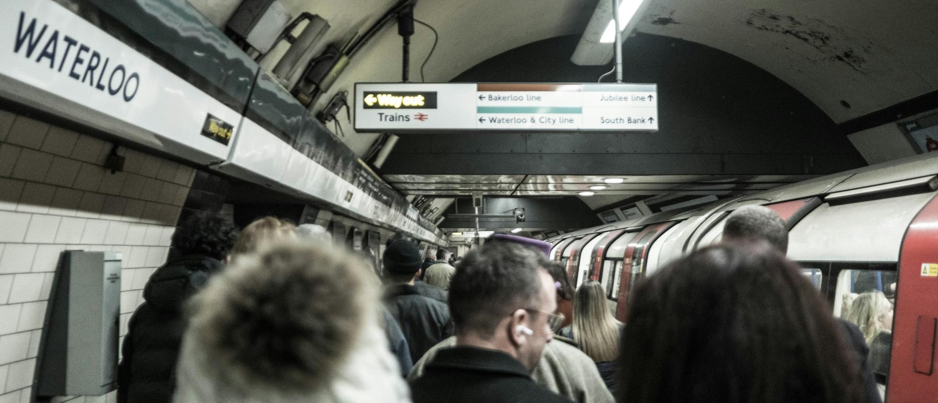 Crowded underground subway train station